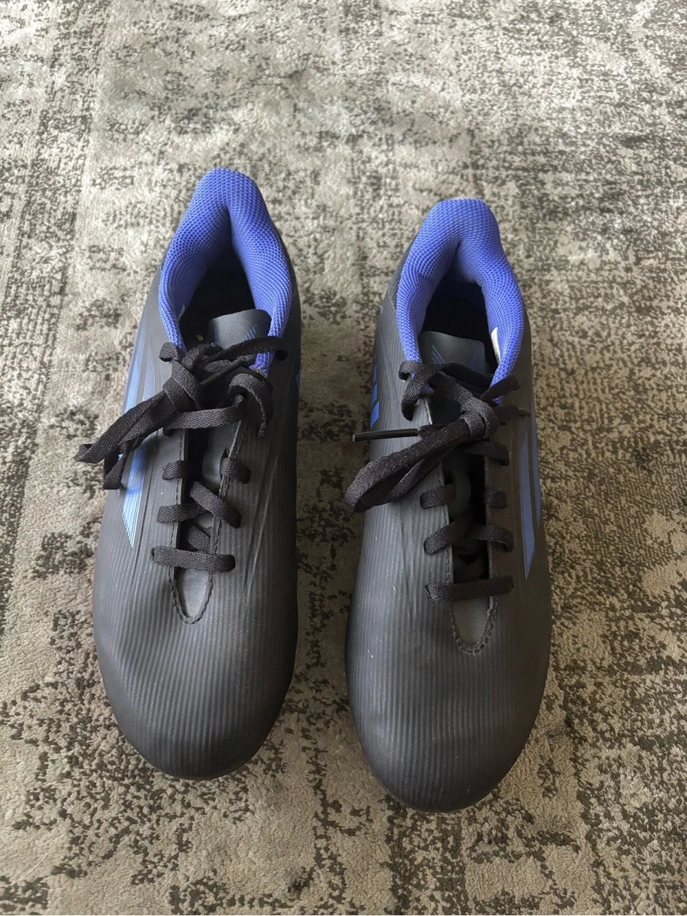 adidas Kids Black Soccer Cleats with Blue Logos and Pink Soles